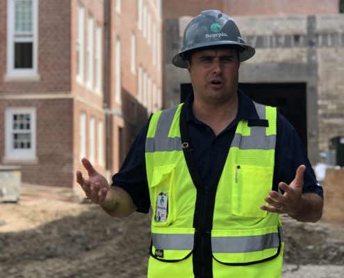 Jason Diven in front of Norman Hall construction
