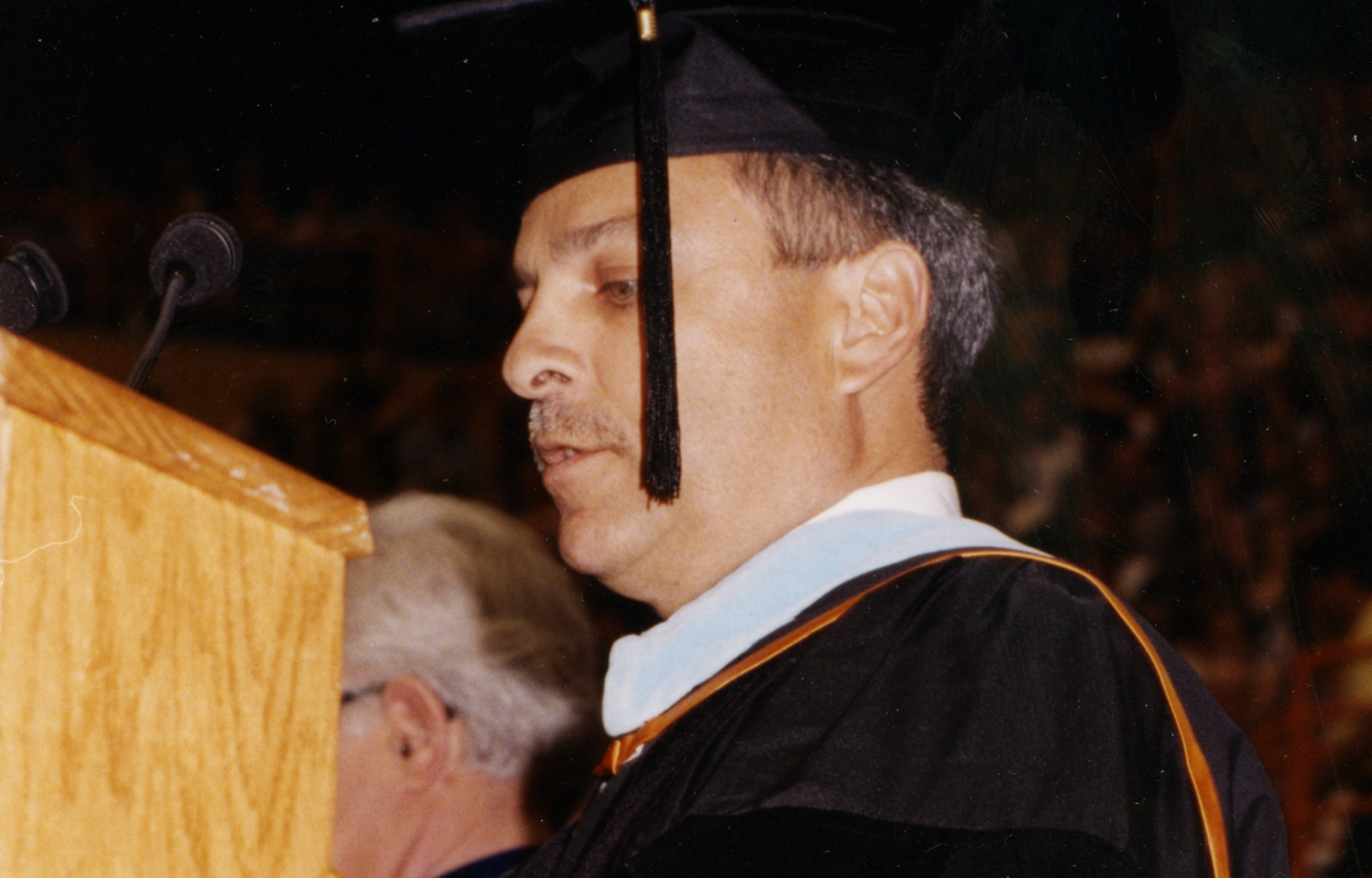 Named interim dean of the College of Education in 2000, Gonzalez presented graduates with their diplomas.