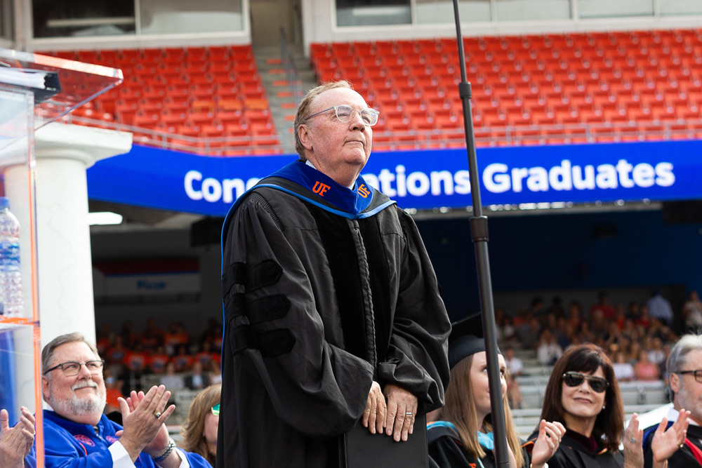 James Patterson in a graduation robe.