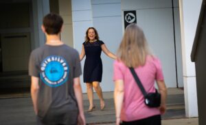 Jennifer Homard greets Santa Fe College students