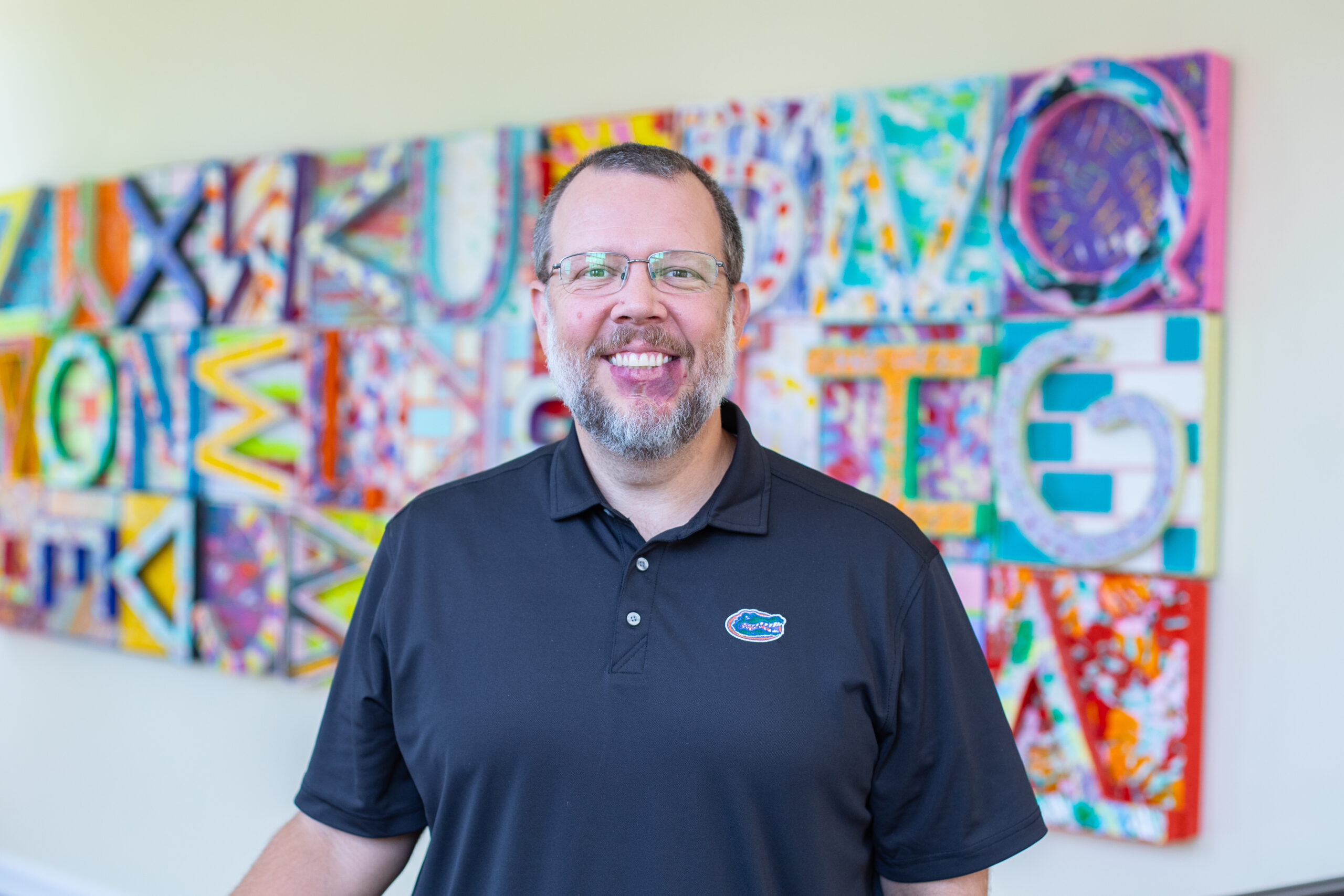 Headshot of Jon Mundorf smiling inside of College of Education
