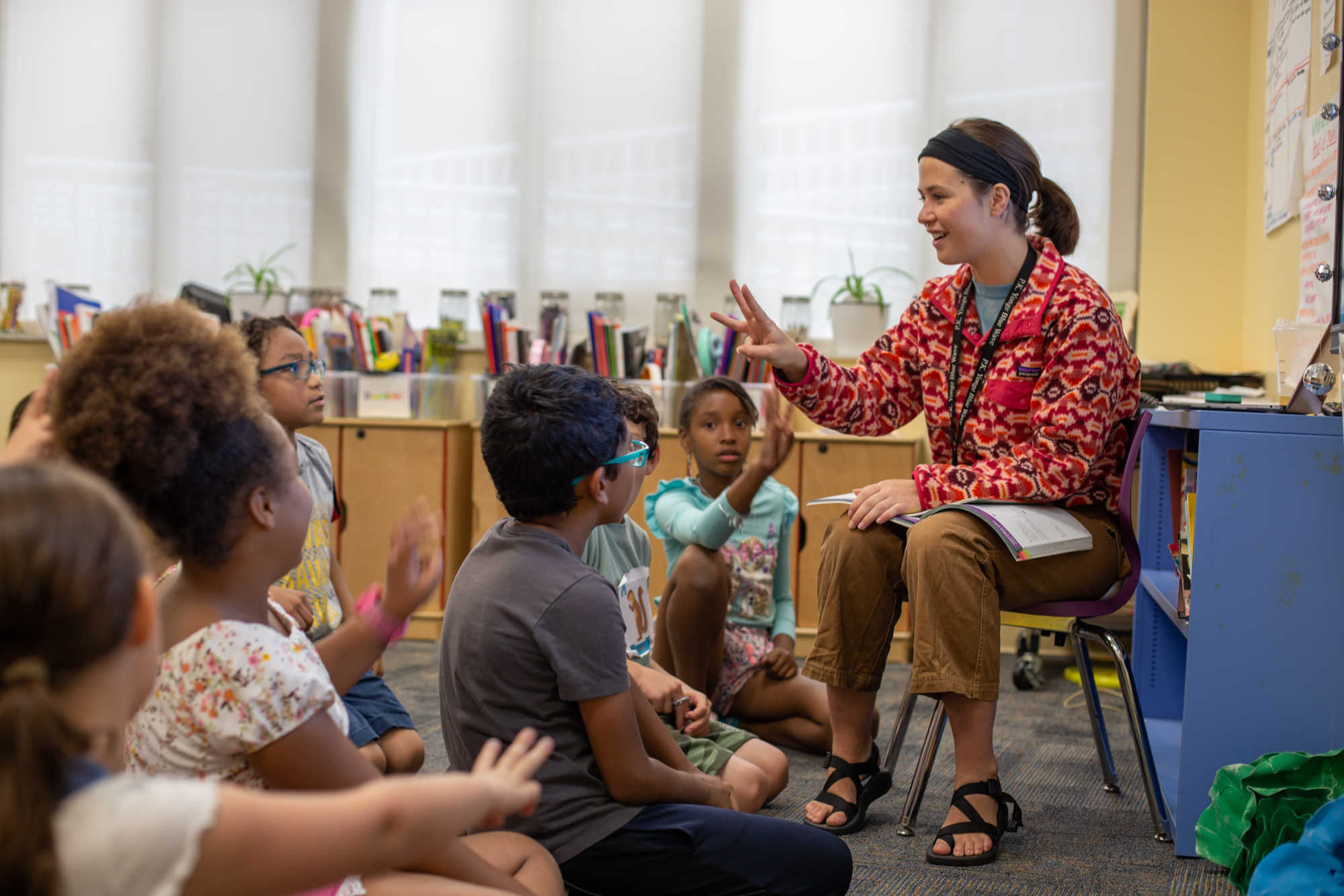 Teacher speaking to group of students