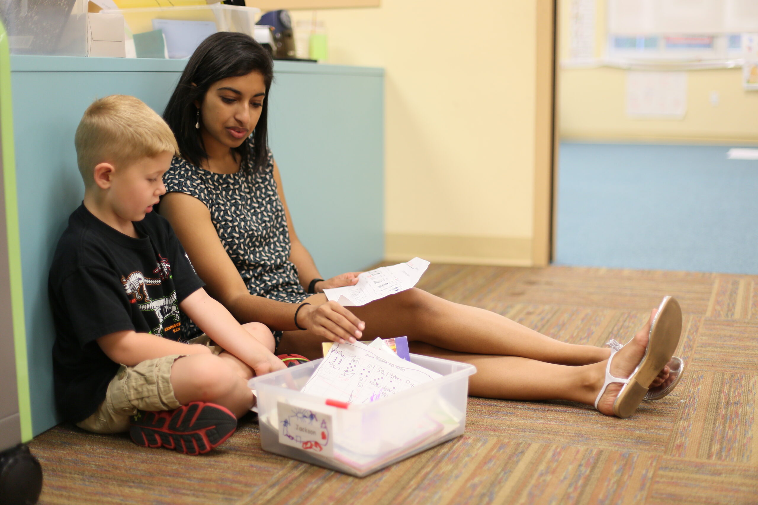 Teacher and student going over an assignment