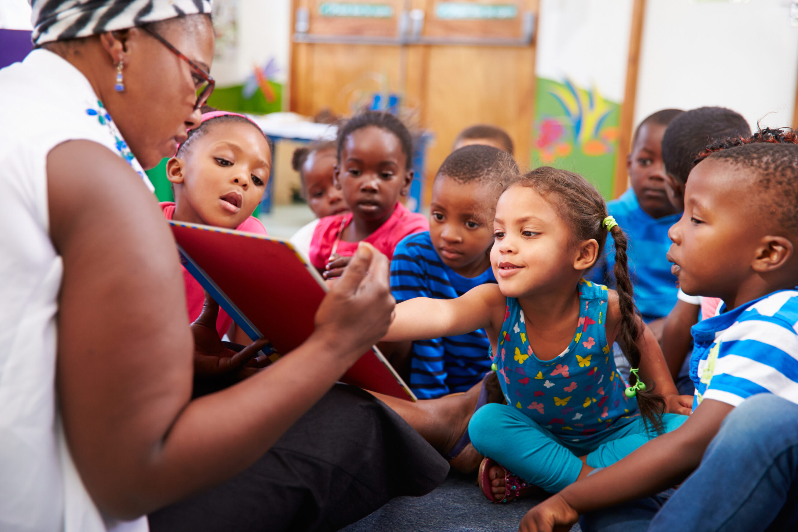 Early Childhood Teacher Reading Book to children