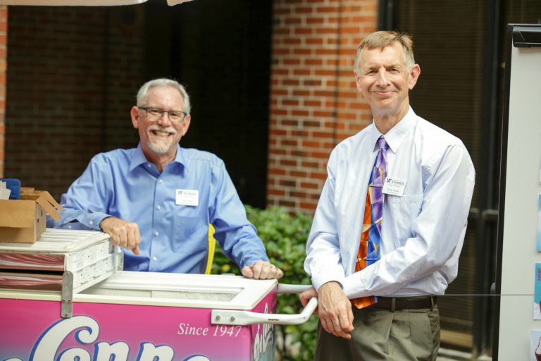 Dr. Tom Dana and Dr. Glenn Good handing out ice cream to students at the ice cream social in 2017.
