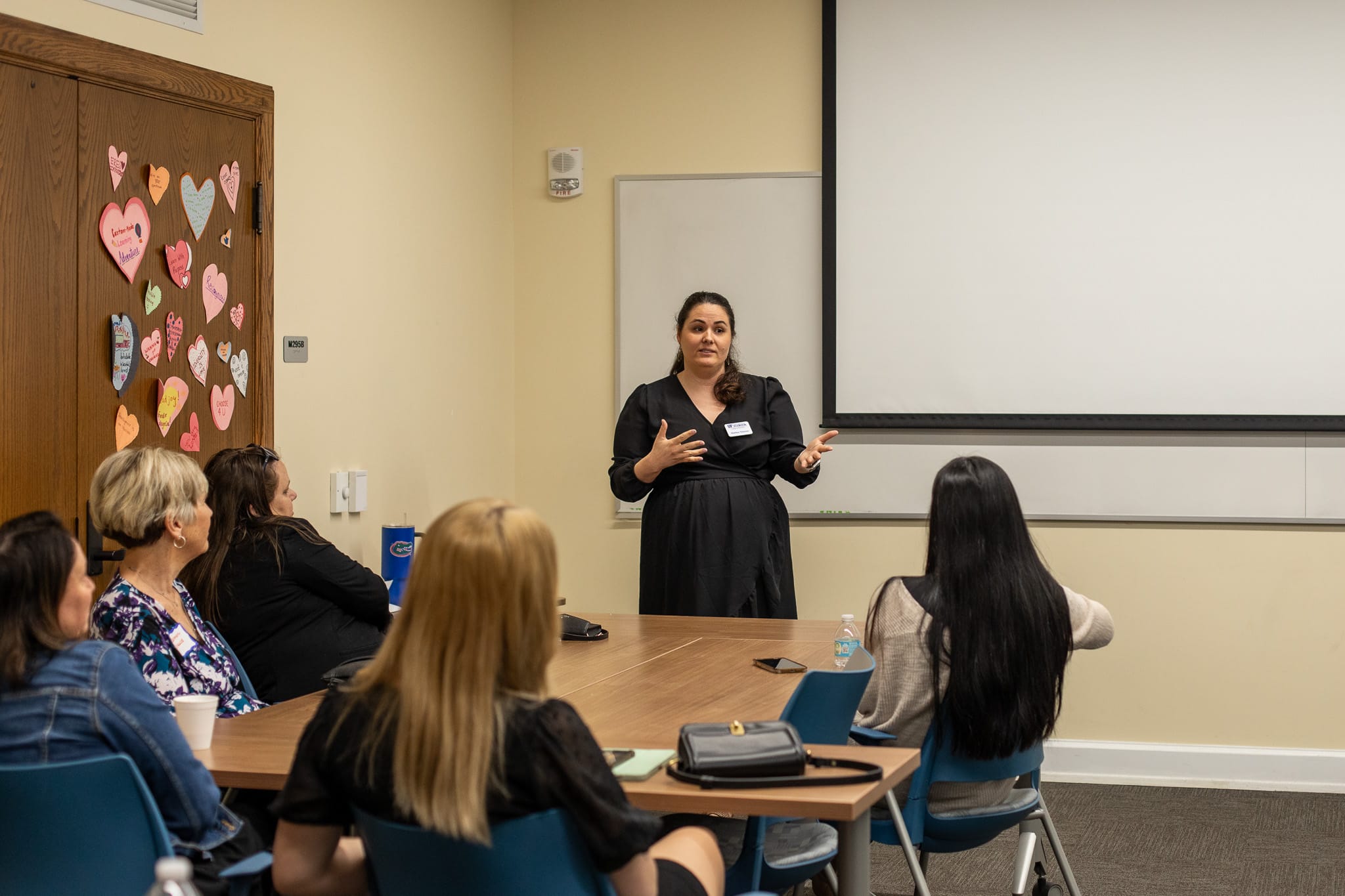 Ed tech students discussing in the hallway