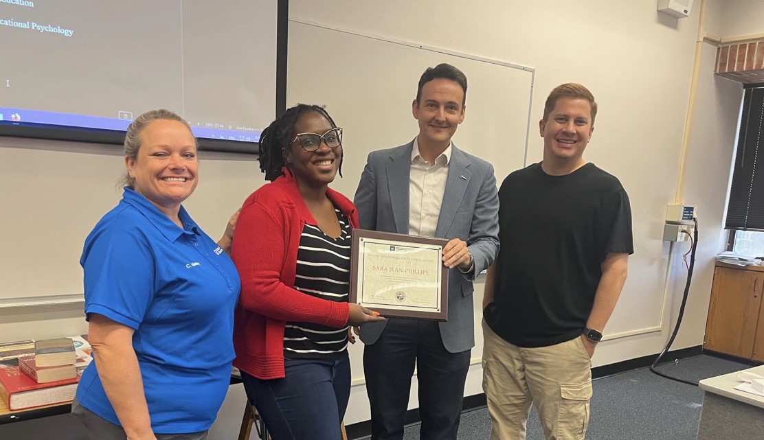 HDOSE faculty receiving award.