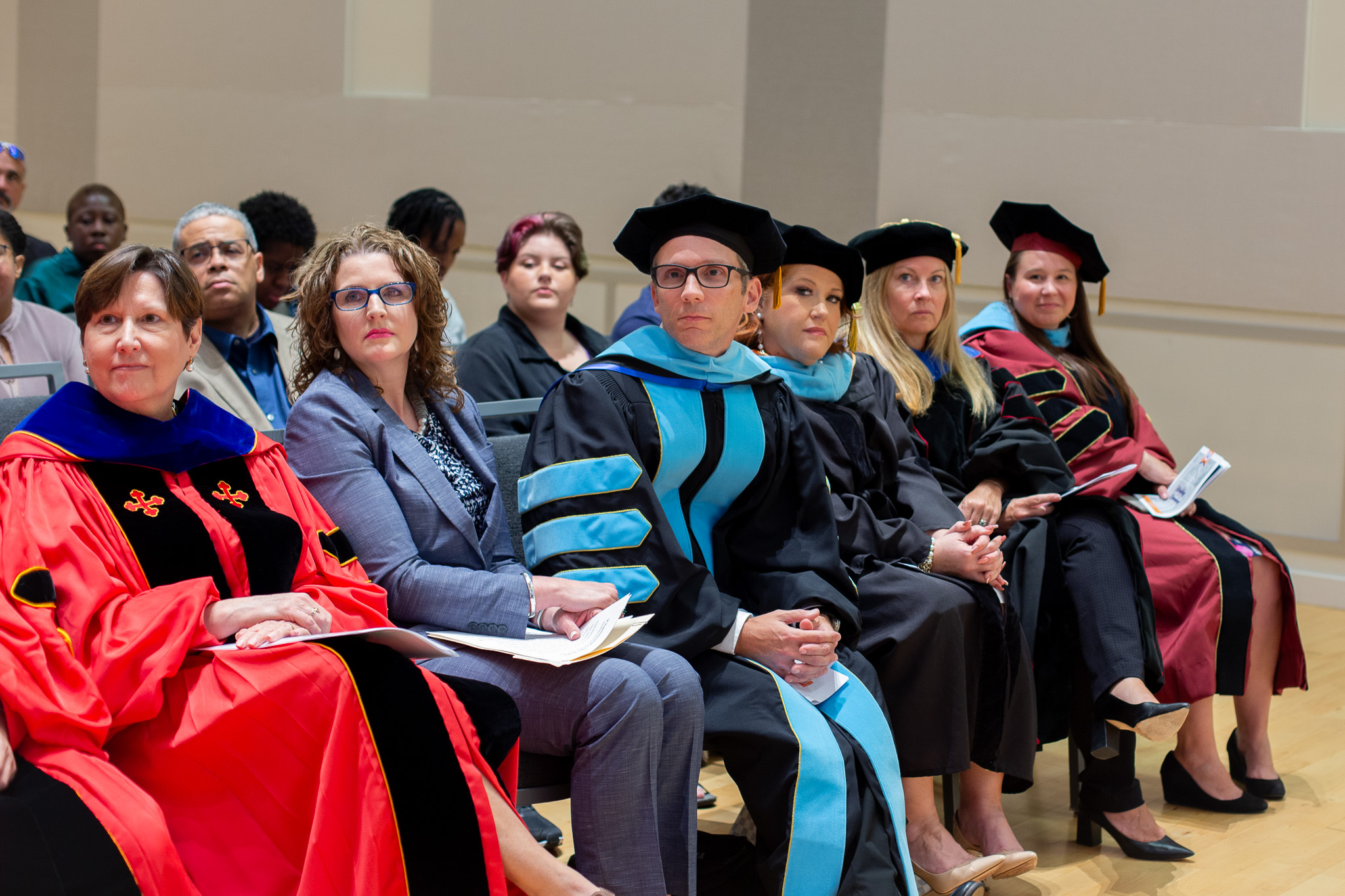 Ed tech students discussing in the hallway