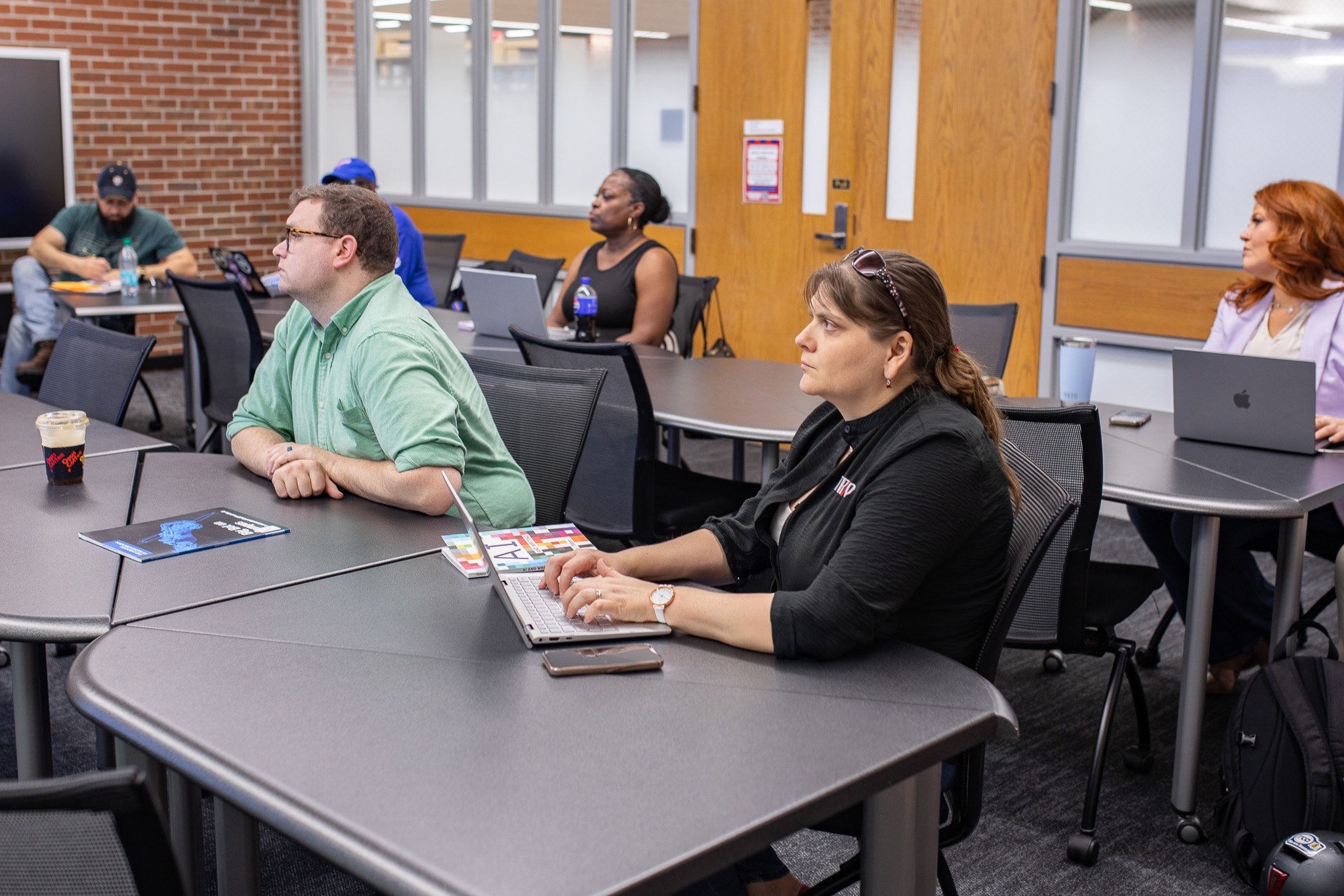 Ed tech students in a lecture in a conference room