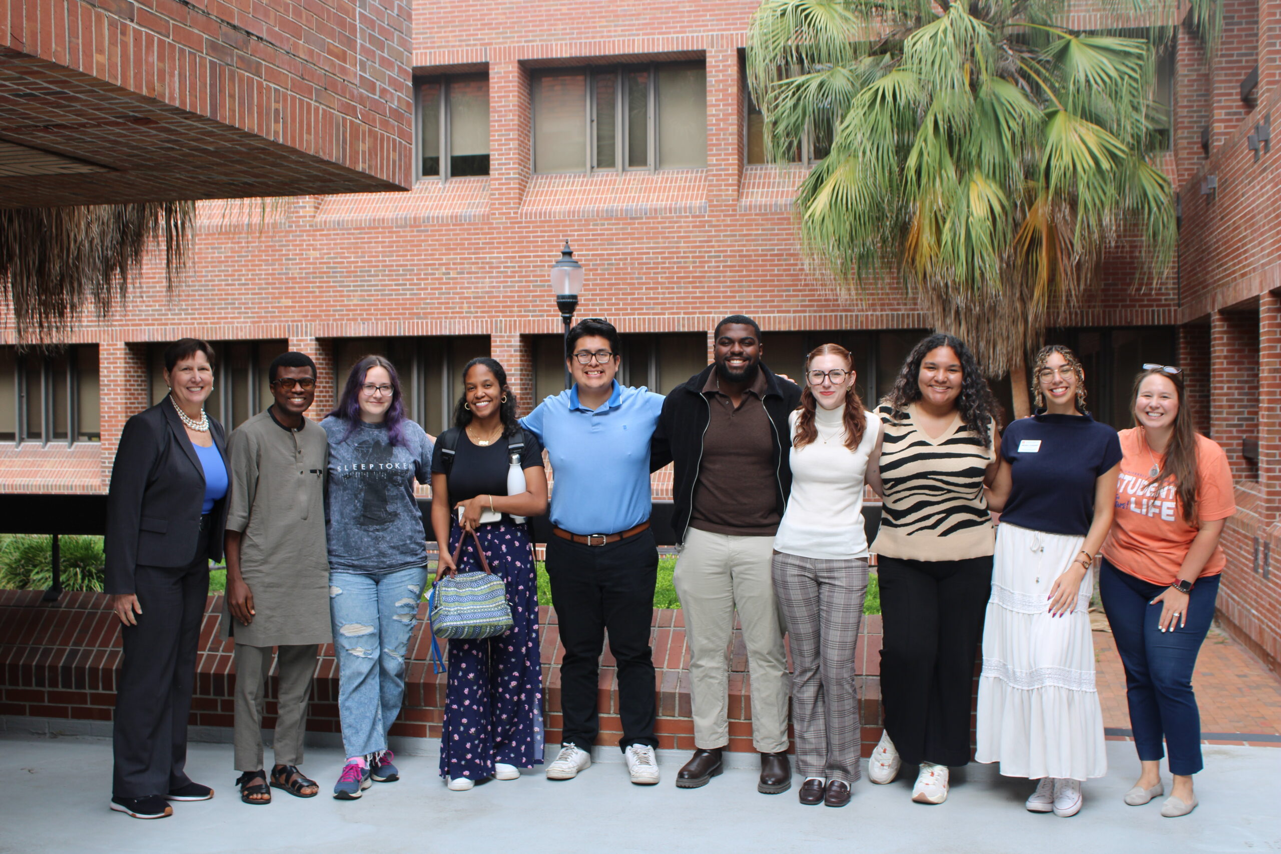 Ed tech student discussing assignment with a professor