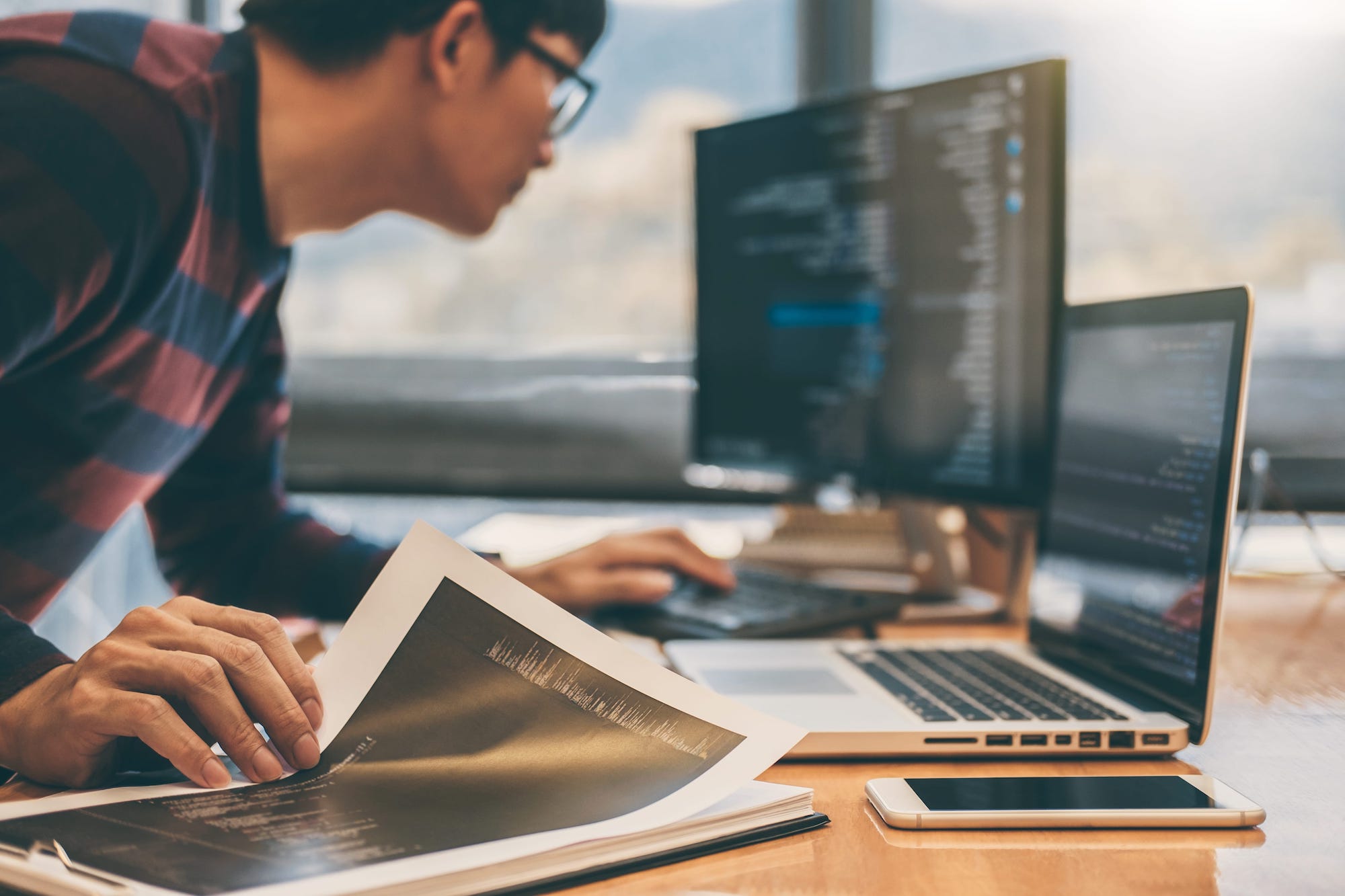 Student using laptops and coding