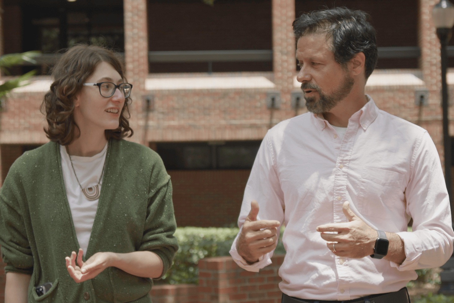 Walter talking to a student at UF Norman Hall