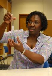 Rose Pringle holding test tube in science lab