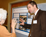 Troy Sadler explains research poster