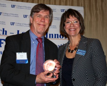 UF Distinguished Alumnus Award recipient Andy Horne poses with COE senior development director Maria Martin at the college's recent Recognition Dinner.