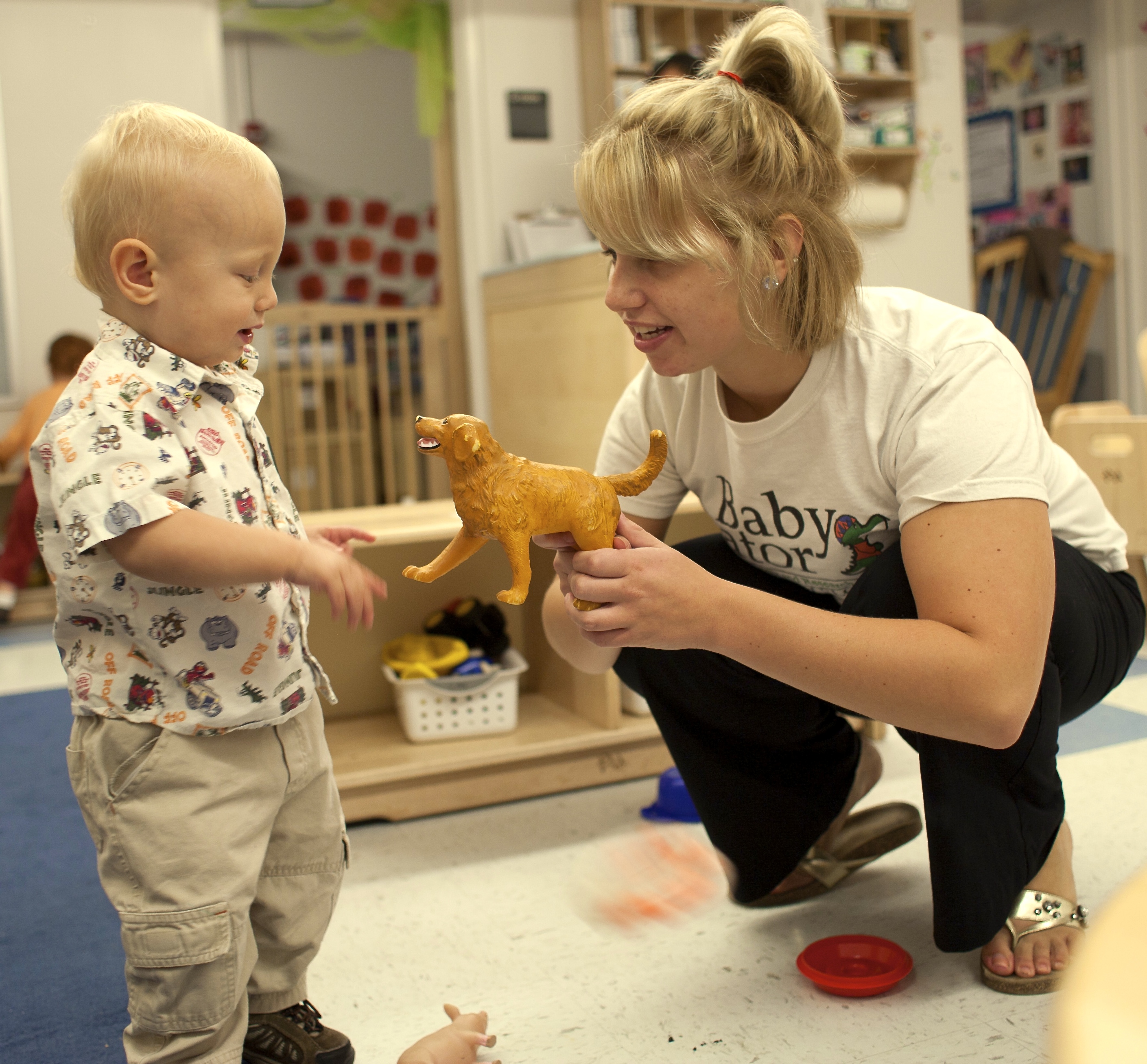 A toddler and a preschool teacher at Baby Gator Child Development Center. 