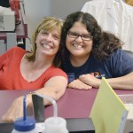 Kathy Savage participates in a laboratory exercise during the summer program with Houda Darwiche, a post doctoral fellow with the Center for Precollegiate Education and Training.