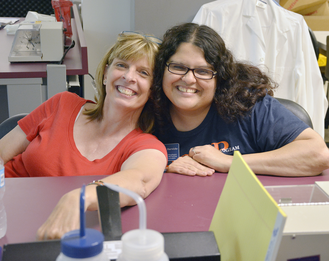 Kathy Savage participates in a laboratory exercise during the summer program with Houda Darwiche, a post doctoral fellow with the Center for Precollegiate Education and Training.