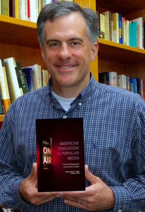 Sevan Terzian with his latest book, featuring several UF education alumni contributors