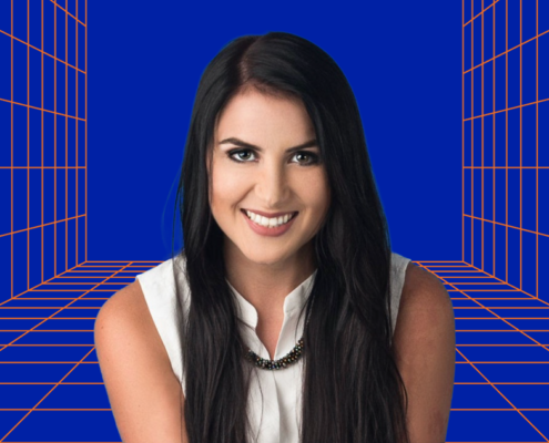 A headshot of Taylor Burtch. She is smiling at the camera and wearing a white shirt. Behind her is UF momentum branding with a blue background and orange lines.
