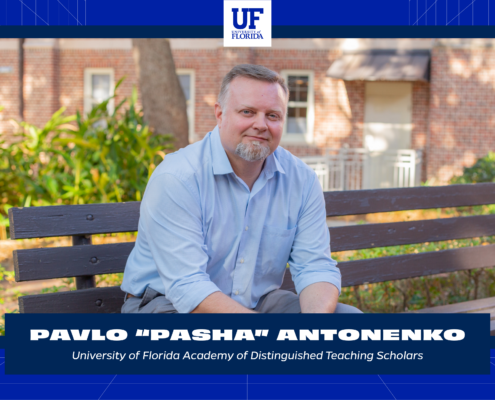 A graphic in the UF Momentum style featuring a photo of Pavlo “Pasha” Antonenko sitting on a bench and smiling. It also includes his name, the UF logo, and the words University of Florida Academy of Distinguished Teaching Scholars.