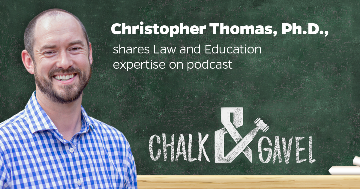 A promotional graphic for a podcast featuring Christopher Thomas, Ph.D., who shares his expertise in Law and Education. The individual’s face is not visible, and the background consists of a chalkboard with text and graphics. Christopher Thomas is wearing a blue checkered shirt. The background is a green chalkbis wearing a blue checkered shirt. The background is a green chalkboard with white chalk writings and drawings. Text on the top right includes his name and shares Law and Education expertise on podcast”. Below this text, there’s a logo or title that reads “CHALK & GAVEL” in a white chalk-like font; there’s an illustration of a gavel and chalk intertwined. On the bottom right corner of the chalkboard, there are two pieces of white chalk.