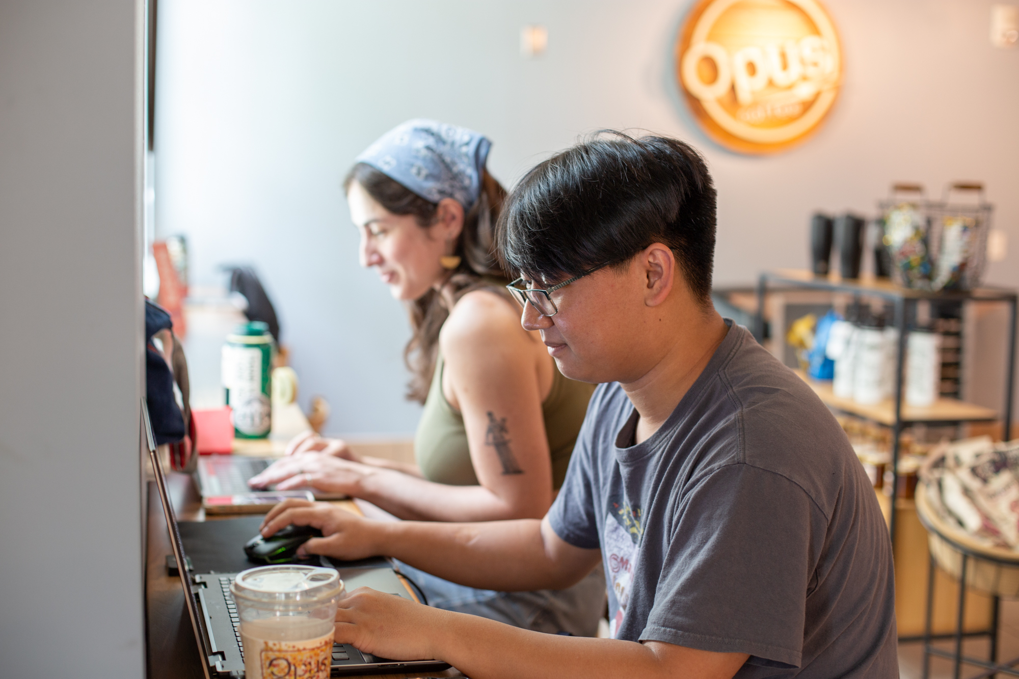 Two students studying at Opus Coffee
